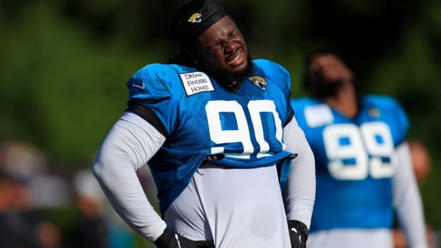 Jaguars defensive tackle Malcom Brown stretches.